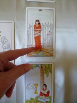 Pointing to Tarot Card in a Reading